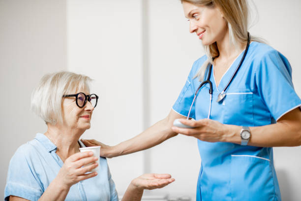 istock Nurse giving some medicine for a senior patient 1178492211