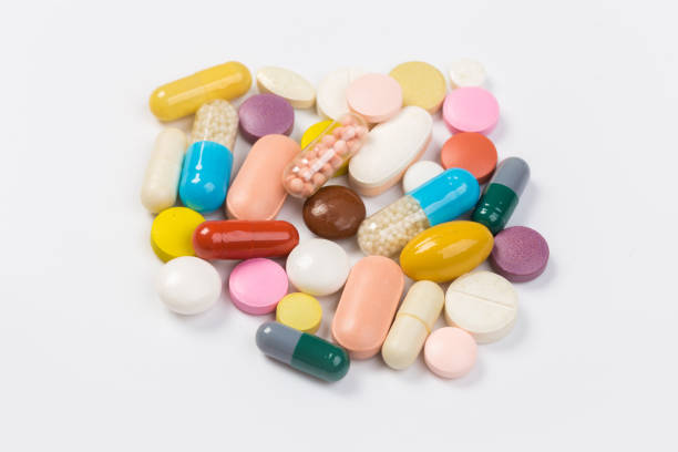 istock Assorted pharmaceutical medicine pills, tablets and capsules.Heap of assorted various medicine tablets and pills different colors on white background. 1178492968