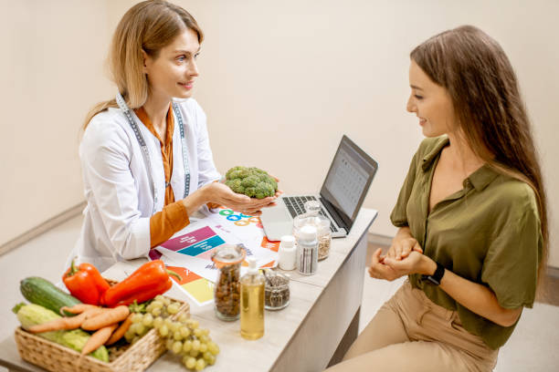 istock Nutritionist with female client at the office 1178493987