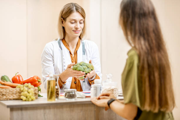 istock Nutritionist with female client at the office 1178493998
