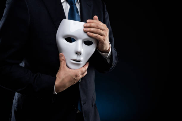 istock Man in suit and mask 1178499550