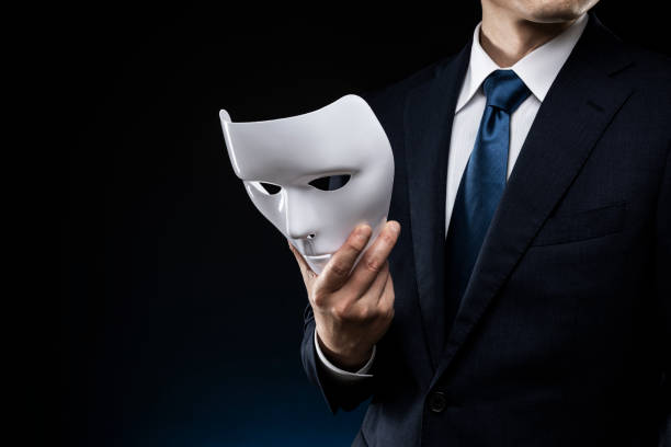 istock Man in suit and mask 1178499571