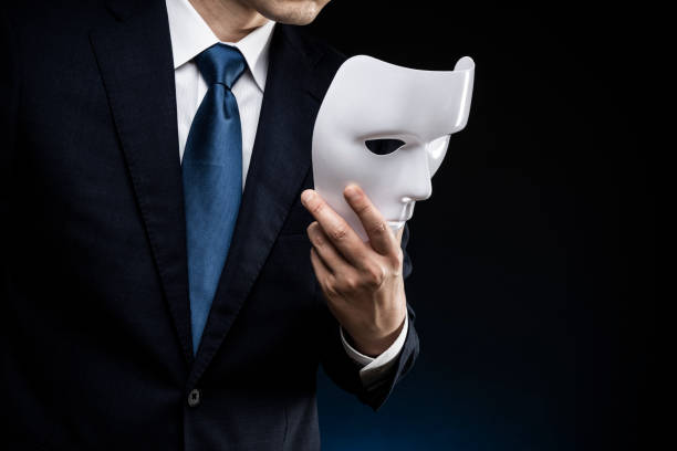 istock Man in suit and mask 1178499591