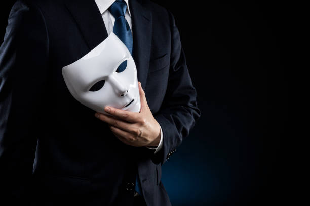 istock Man in suit and mask 1178499615