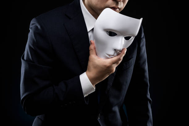 istock Man in suit and mask 1178499683