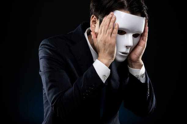 istock Man in suit and mask 1178499728