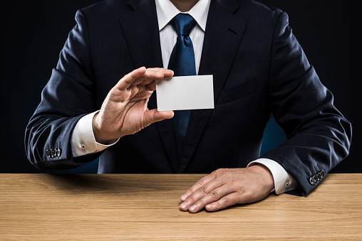 Businessman handing business card