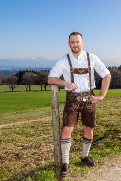 bavarian traditional man outdoors An image of a bavarian traditional man outdoors Lederhosen stock pictures, royalty-free photos & images