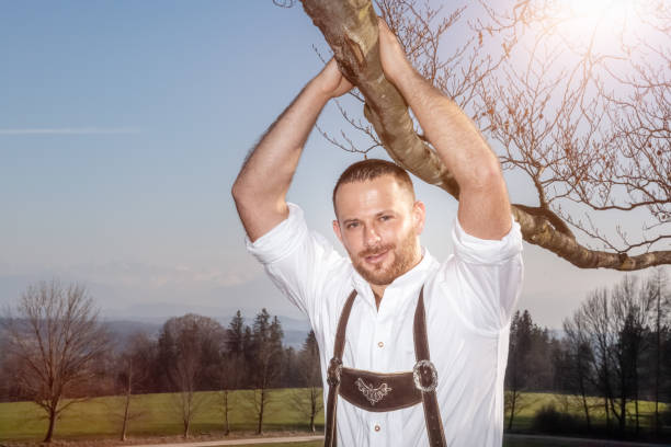 istock bavarian tradition man in the grass 1178501169