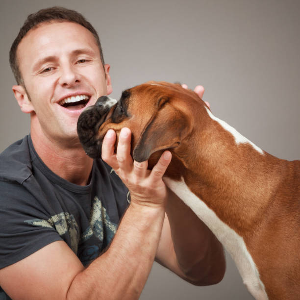 istock handsome laughing man with his dog 1178501237