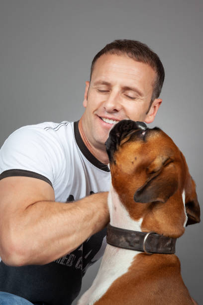 istock handsome muscle man with his dog 1178501262