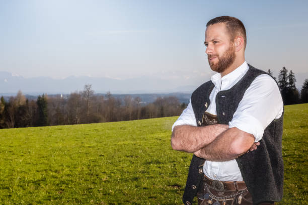 istock bavarian tradition man in the grass 1178501906