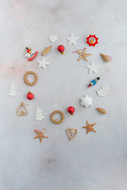 istock Christmas decorative pendants arranged in a circle on a bright background. 1178502199