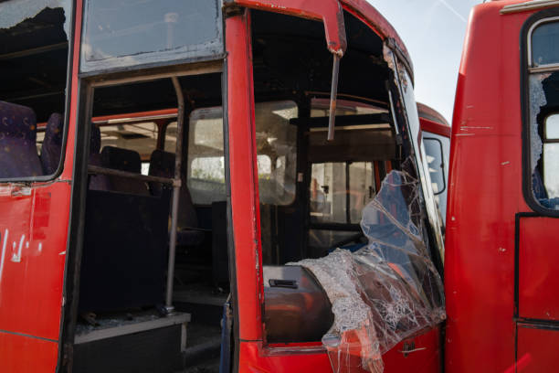 istock Bus collision crush traffic accident broken wrecked buses with smashed windshield shredded glass ready for scrap junk 1178503896
