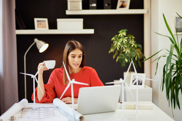 istock Woman drinking coffee in office. 1178504414