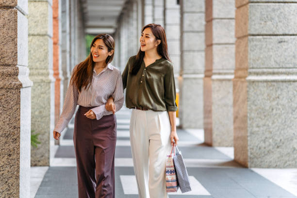 istock Two young women shopping in mall 1178504762