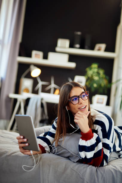 istock Woman using tablet in bedroom. 1178504946