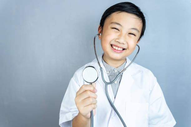 istock Little boy and stethoscope in doctor uniform with copy space. 1178506034