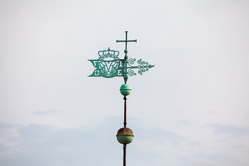 cross with arrow on the church top