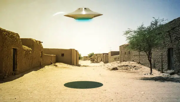 Photo of ufo flying over a desert village