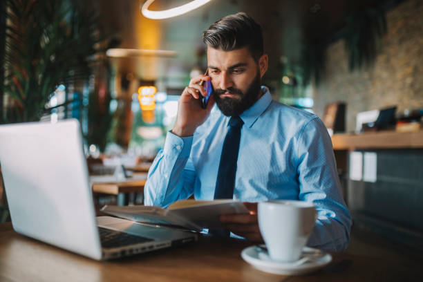 istock Business man drinking coffee in a cafe 1178511421