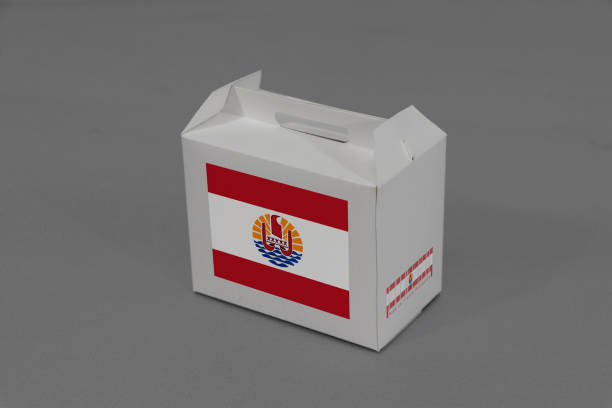 istock French Polynesia flag on white box with barcode and the color of nation flag on grey background. The concept of export trading from French Polynesia. 1178511437
