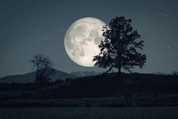 istock moon and stars over dark scenery 1178511902