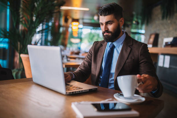 istock Business man drinking coffee in a cafe 1178512779