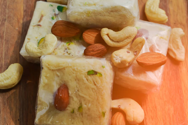 istock Sohan papdi sweet and nuts on wooden table 1178516413