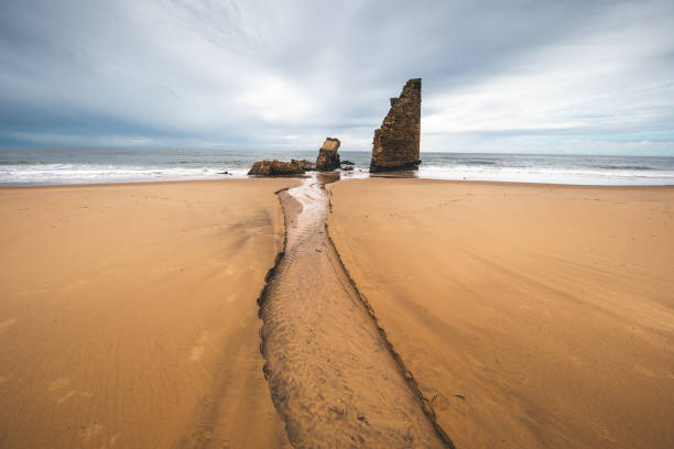 Ruins of Torre del Rio De Oro on the beach in Mazagon, the province of Huelva, Andalusia, Spain.