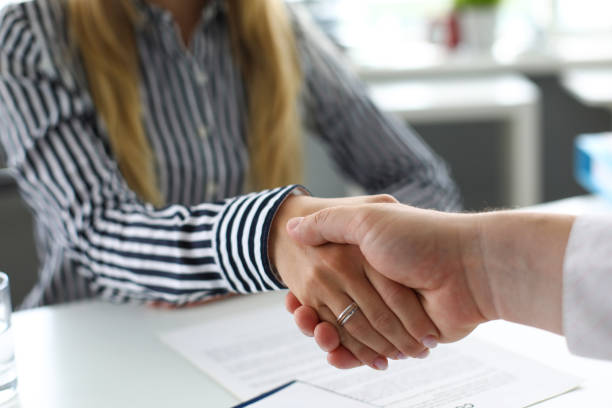 istock Man and woman shaking hands after productive deliberations 1178517732