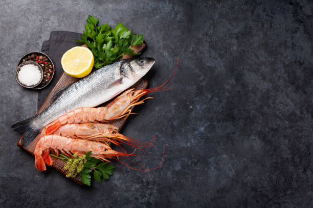 istock Fresh seafood. Trout fish and langostino shrimps 1178517835