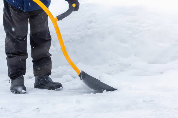 istock A man cleans snow in the yard with a shovel after a heavy snowfall 1178519462