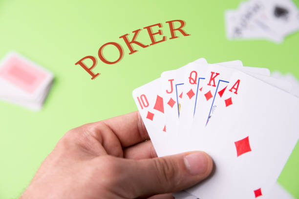 istock Poker with diamonds on a green background. Cards in hand. Copy space 1178520822