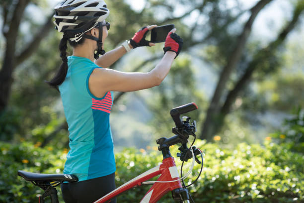 istock Riding on bike path,using smartphone while riding bike on sunny day 1178522108