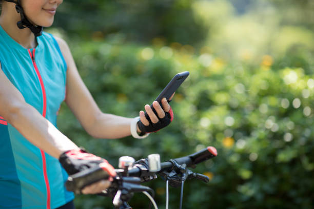 istock Riding on bike path,using smartphone while riding bike on sunny day 1178522304