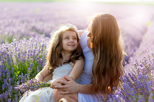 Mother with daughter in a lavender field