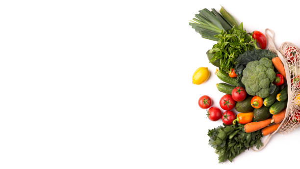 istock Fresh and colorful vegetables inside eco bag on white 1178524865