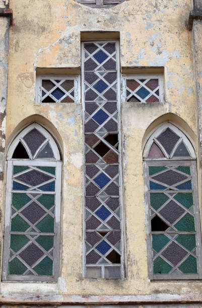 istock Stained glass window in a church with cross shape 1178525032