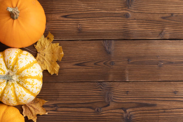 istock Pumpkins and autumn leaves 1178525299