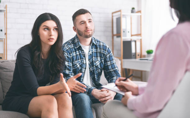 istock Young couple discussing their problems at marital therapy 1178526444