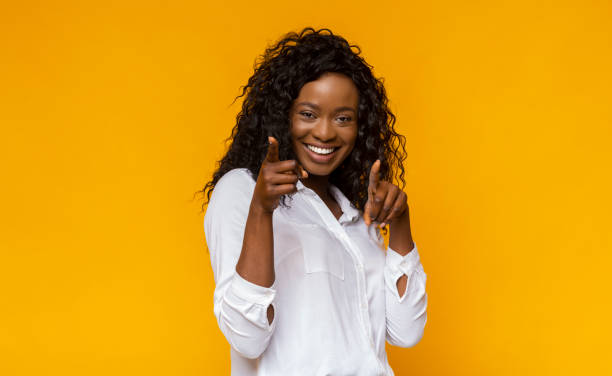 istock Attractive afro girl pointing her fingers at camera 1178526618
