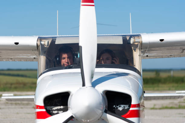 istock A beautiful, young business lady and her personal pilot. 1178526796