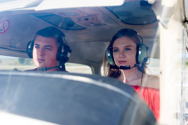 istock A beautiful, young business lady and her personal pilot. 1178526798