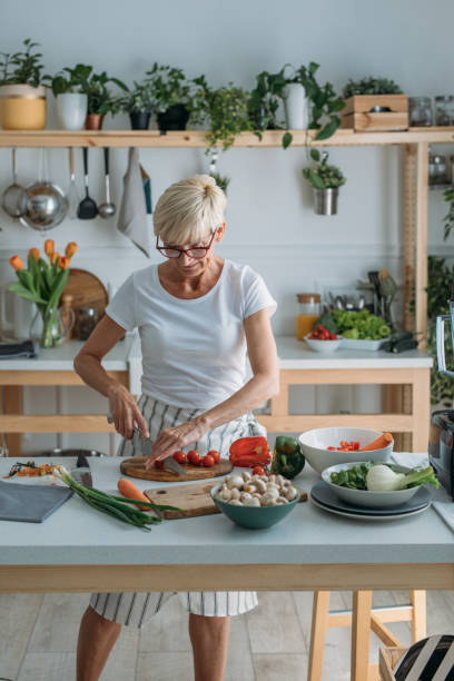istock Woman Preparing Food at Kitchen 1178527011