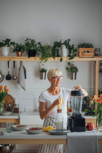 istock Senior Woman Blending Fruit 1178527098