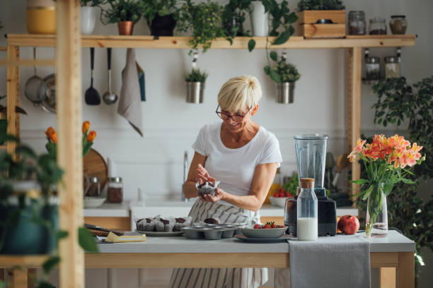 istock Woman Holding Muffins 1178527108