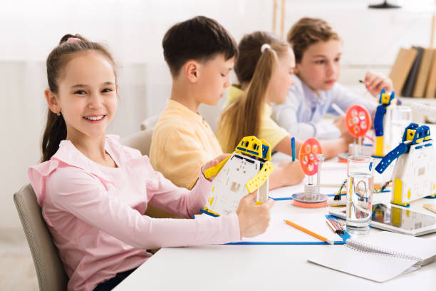 istock Stem education. Girl creating robot at lab 1178528383