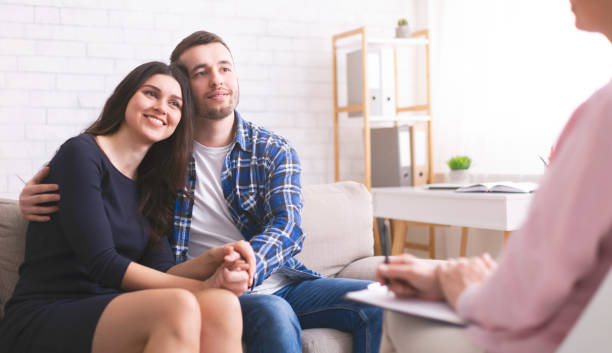 istock Cheerful spouses bonding at consultation with psychologist 1178529546