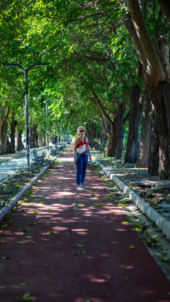 istock woman walking on the walkway 1178531153